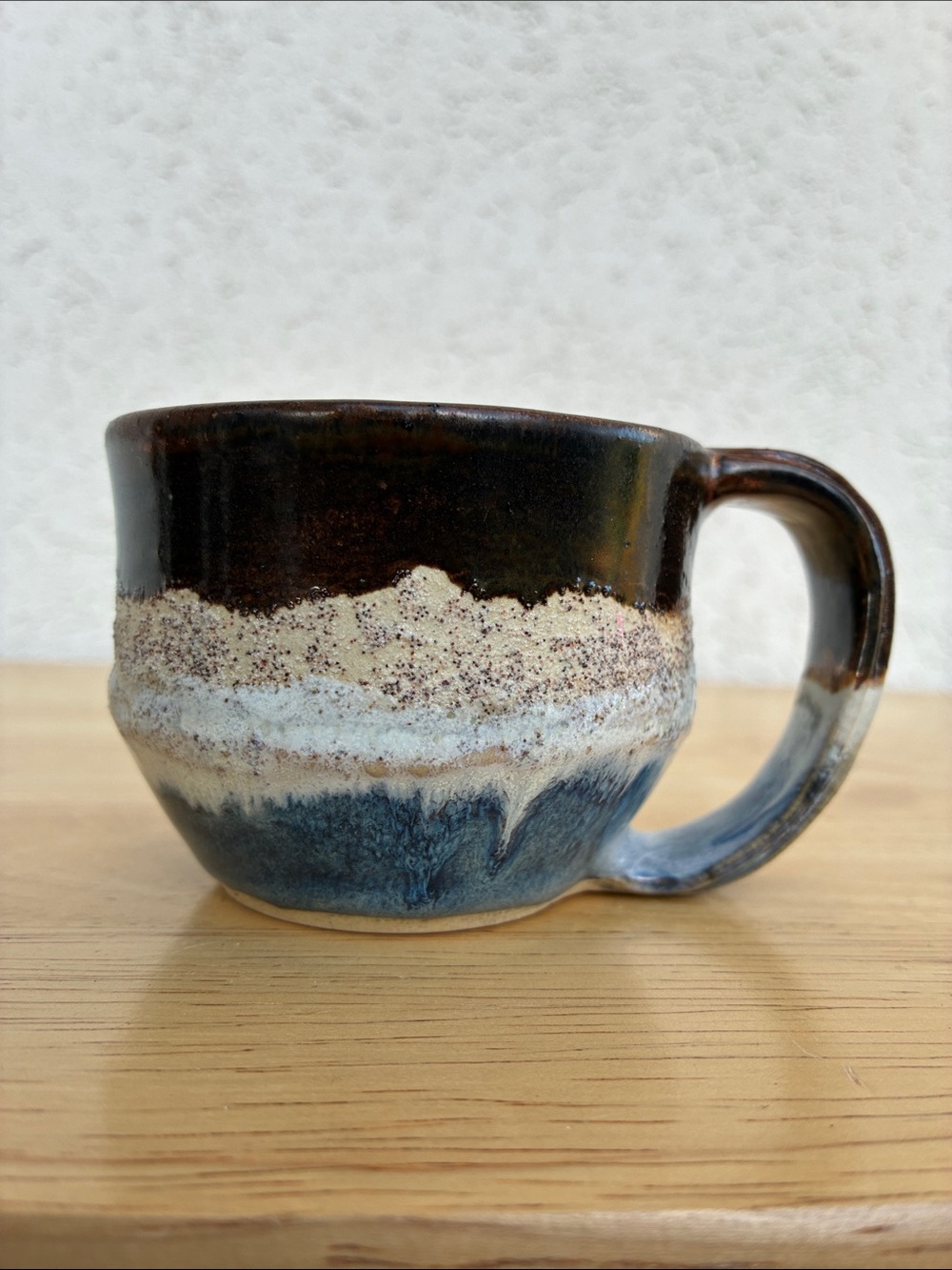 Hand turned pottery mug in Dark Brown, Cream & Blue. Smaller size  makers mark